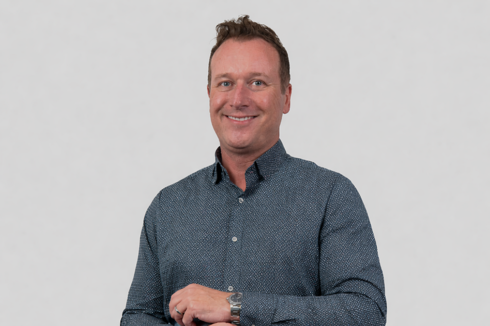 Confident smile in professional portrait.png