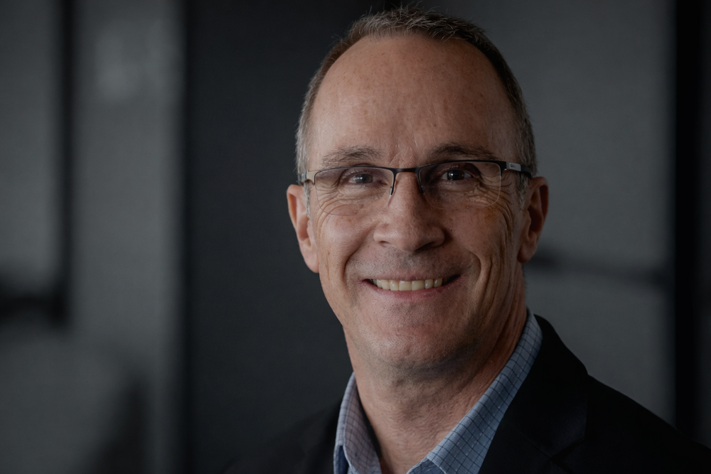 Professional portrait in a suit.png