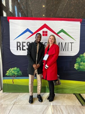 MMC Mlungisi Mabaso, representing the Department of Human Settlements and Debbie Tagg, Chairperson of the Reside Summit.jpg