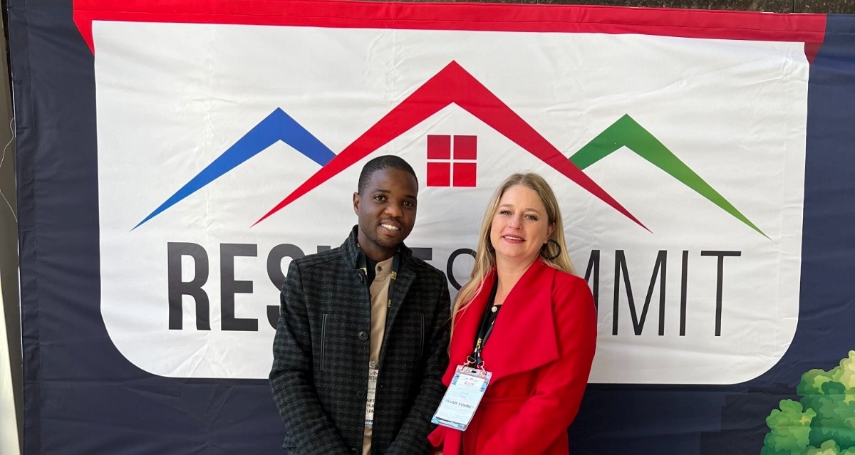MMC Mlungisi Mabaso, representing the Department of Human Settlements and Debbie Tagg, Chairperson of the Reside Summit.jpg