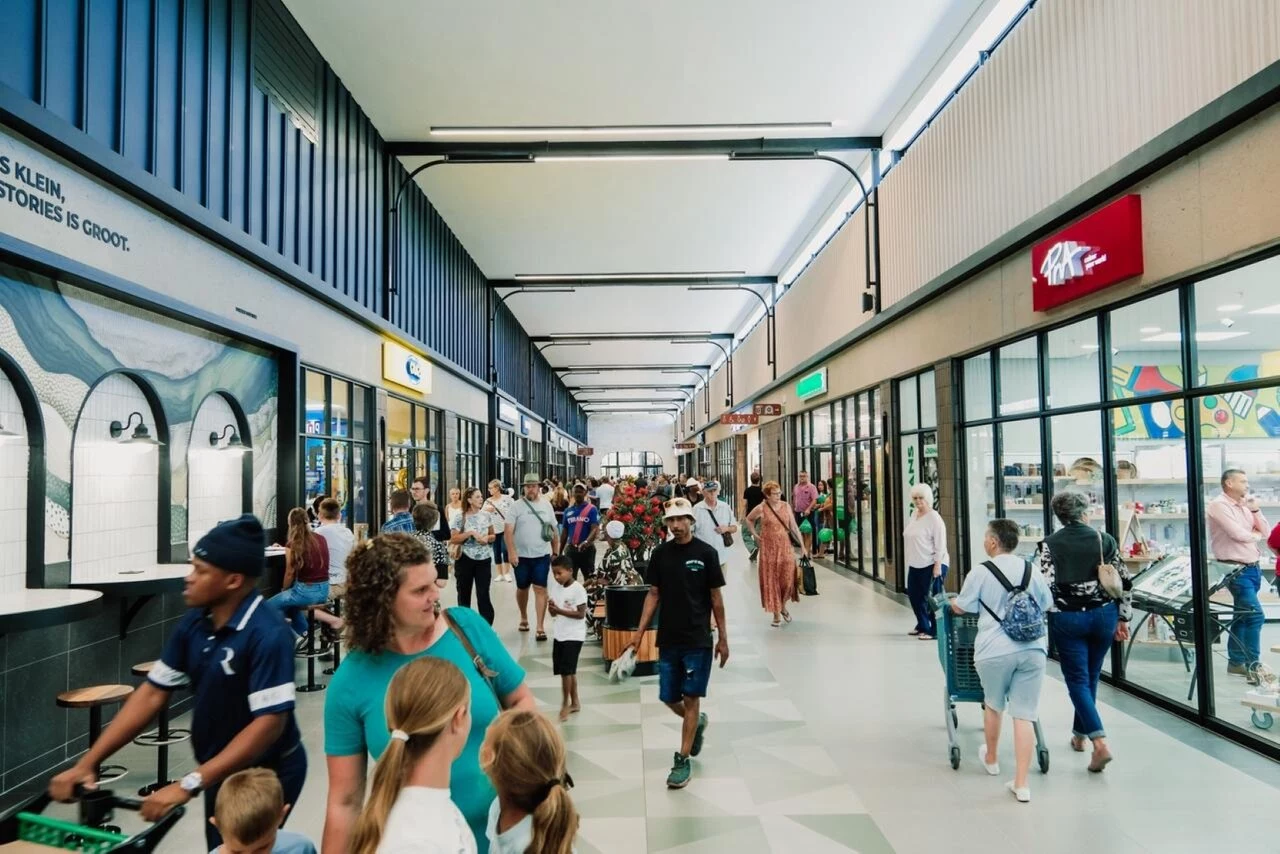 Shoppers explore Garden Walk’s bright, modern retail spaces on opening day.jpg