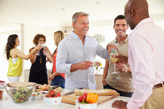 800_497892980groupofmaturefriendsenjoyingdinnerpartyathome.jpg